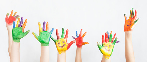 Lot of painted hands raised up, Children's Day