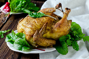 Baked chicken with spices and chard leaves
