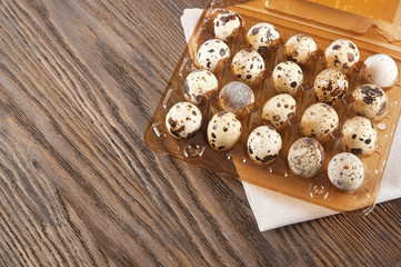 Quail eggs in a plastic box
