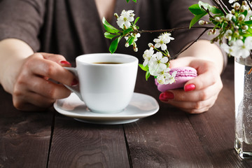 Coffee and macaron cookies on table in the morning