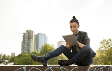 Young female reading on her tablet