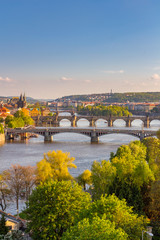 View of the Vltava River and the bridges shined with the sunset sun, Prague, the Czech Republic