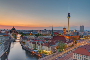 Sunset over downtown Berlin with the famous television tower - obrazy, fototapety, plakaty