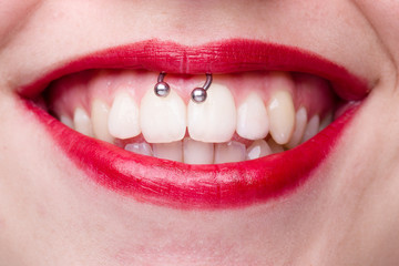 Smiley Piercing Detail with Smiling Woman's Mouth