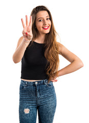 Obraz premium Young girl counting three