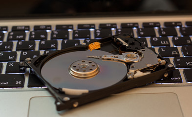 Opened hard disk drive on keyboard