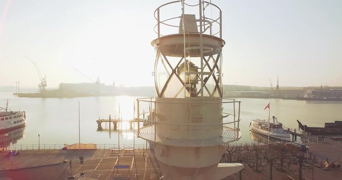 Museumshafen Kiel im Gegenlicht vom Sonnenaufgang in Kiel Schleswig Holstein im Hintergrund die Schiffswerft von  Kiel
