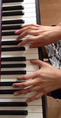Obraz premium hands of teen girl while playing piano