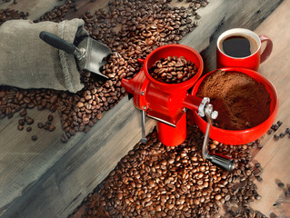 Red coffee mill and coffee beans