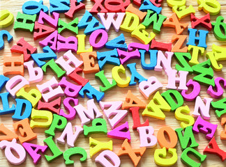 Multiple colored wooden letters