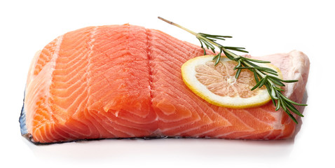 Fresh raw salmon fillet with lemon isolated on white