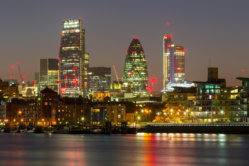 Fototapeta na wymiar Cityscape of London with reflection in Thames river at night, UK