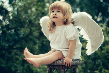 Little boy dressed as angel