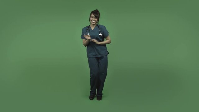 indian female doctor isolated on greenscreen happy dance