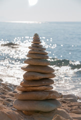Fototapeta na wymiar Balanced stones on a pebble beach