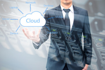 Double exposure of cloud computing concept on hand of a businessman with servers computing technology in datacenter creative cloud concept
