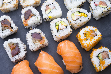 Sushi rolls on a slate plate