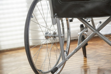 Fototapeta na wymiar Close up of a wheelchair's wheel