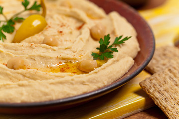 Healthy Homemade Hummus with Olive Oil. Selective focus.