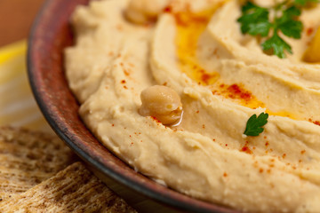 Healthy Homemade Hummus with Olive Oil. Selective focus.