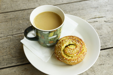Bun with a cup of coffee