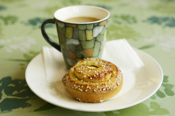 Bun with a cup of coffee