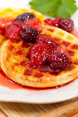 Waffles with Fresh Strawberry Syrup. Selective focus.