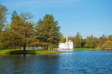 Landscape with a lake and a mosque on shore