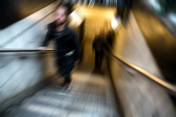 Young man climbing subway steps in New York City