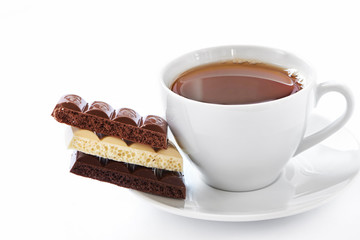 Cup of hot tea and chocolate bars