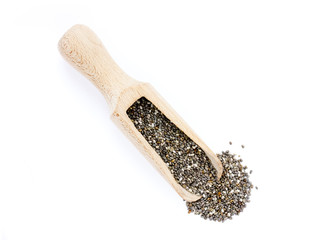 Chia seeds in a wooden scoop isolated