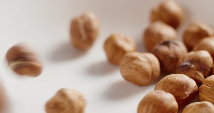 hazelnut falling in 4k, prores footage 60fps