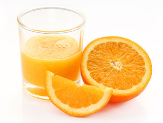 Glass of orange juice, half and slice orange fruit