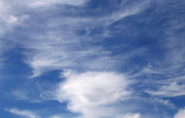 Naklejka na ściany i meble white clouds of all shapes in the blue sky
