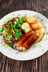 Roasted Sausages with Chips and Mix Vegetable salad
