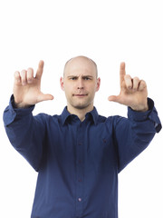 bald man taking a photo