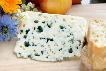 tray with roquefort with bread and flowers