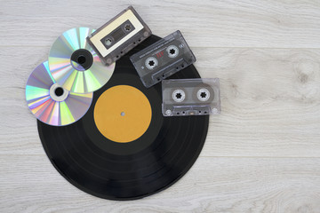Retro, vinyl record disc, audio cassette and cd