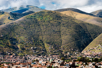 Cusco city view piont with Adean moutain's Peru logo on hill