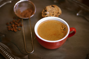 Cup of coffee with cookies on silver tray