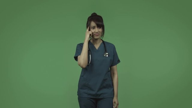 indian female doctor thinking and scratching head isolated on greenscreen