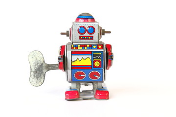 Fototapeta premium isolated vintage tin robot toy, straight face with key on white background