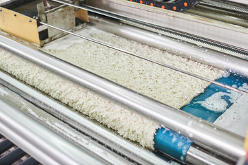 The process of squeezing water out of wet carpet on special equipment