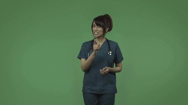 indian female doctor isolated on greenscreen upset talking for interview