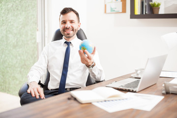 Naklejka premium Young man running a global business
