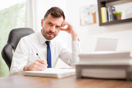 Businessman angry and overwhelmed with work