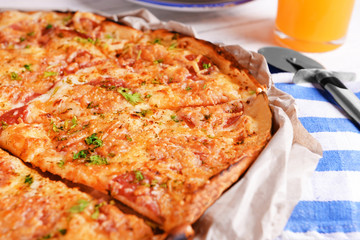 Tasty pizza on wooden table close up