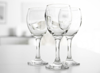 Wineglasses on blurred interior background
