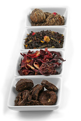 Variety of tea leaves, isolated on white