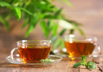 Cups of tea on wooden table